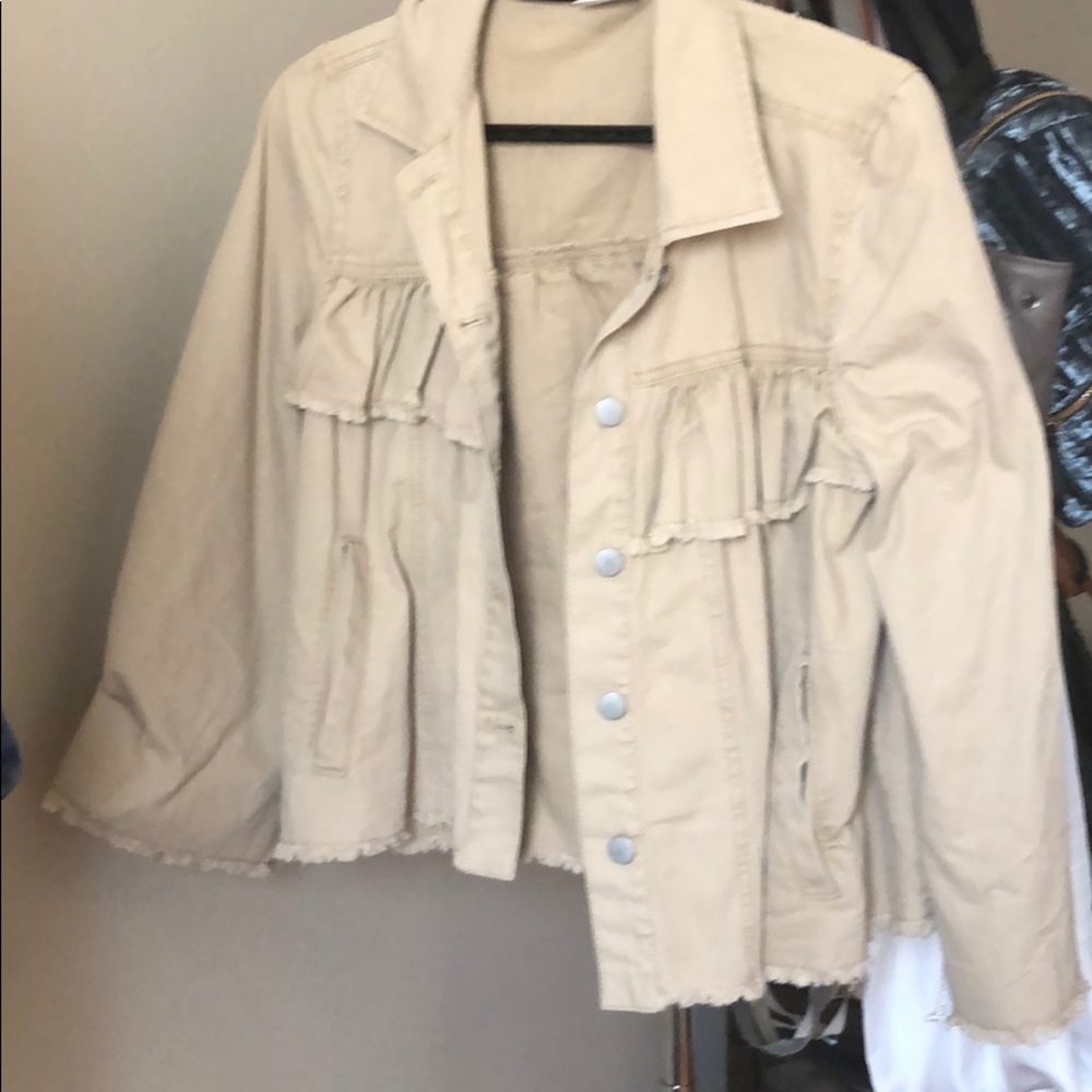 Tan jacket. Never worn new without tags.